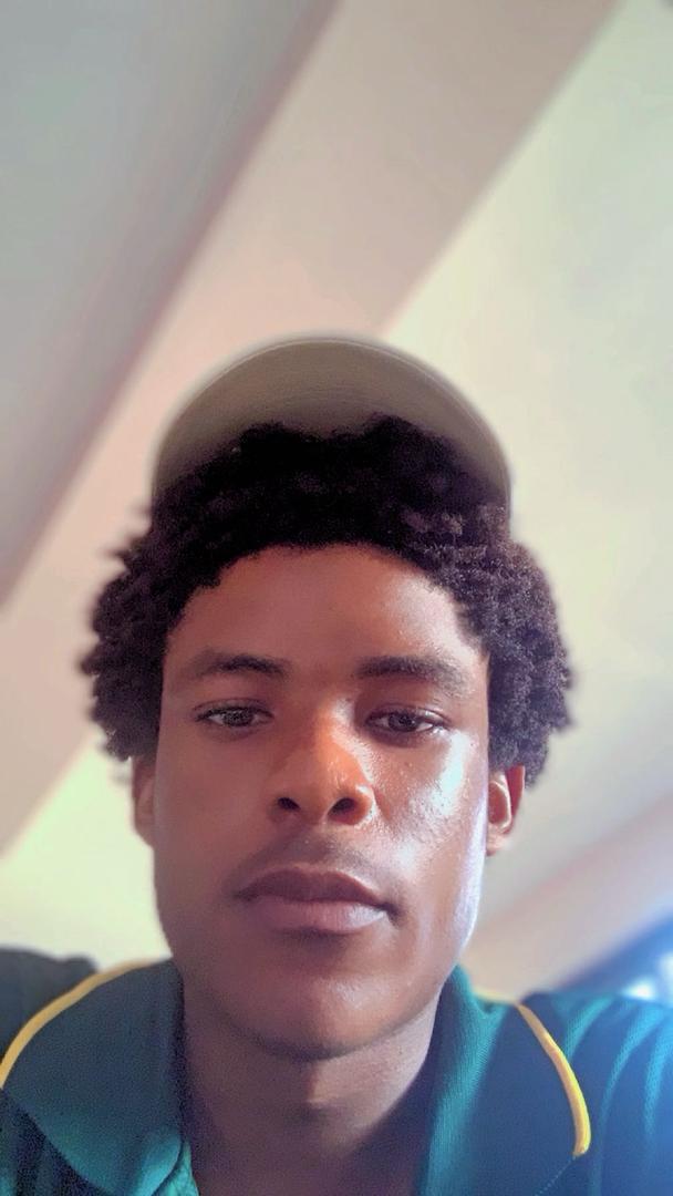 Portrait of a creative designer in a modern studio setting, with graphic design tools visible